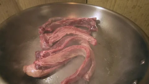Pan Fried Beef Short Rib with Sizzling Oil and Steam Stock Footage 344669463