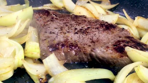 Pan fried beef steak and onions Stock Footage