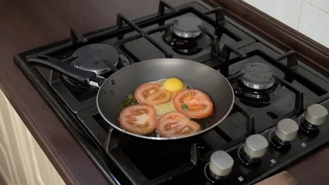 Pan fried egg with tomato Stock Footage 93386170