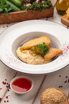 Pan fried fish fillet with mashed potatoes Stock Photos