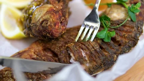 Pan-fried fish.The video shows the process of cooking fried fish in a skillet Stock Footage 323530906