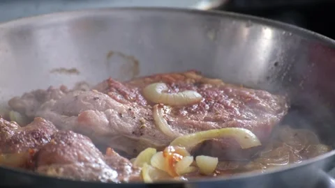 Pan Fried Pork Steaks with Onions  Stock Footage 335225244