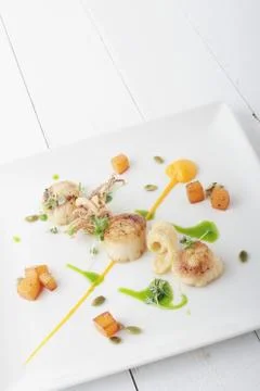 Pan fried scallops Stock Photos