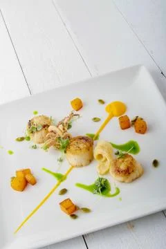 Pan fried scallops Stock Photos