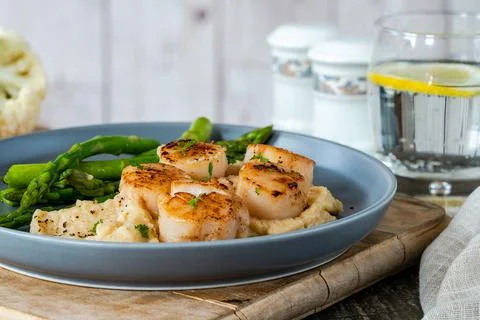 Pan-fried scallops Foto stock