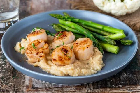Pan-fried scallops Foto stock