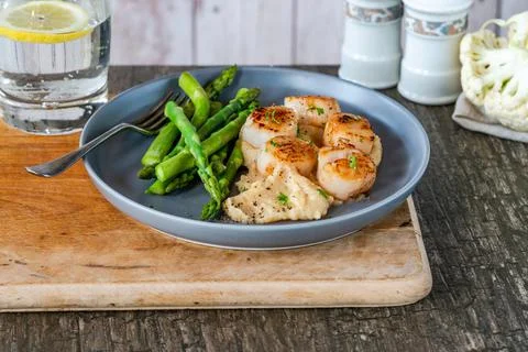 Pan-fried scallops Stock Photos