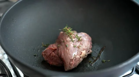 Pan frying steak with thyme Stock Footage 42131256