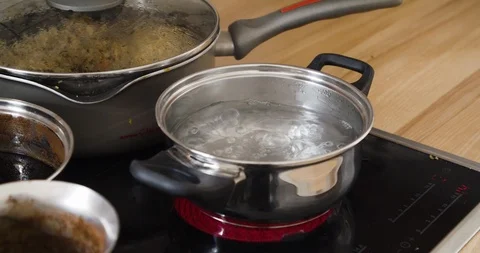 Pan full of boiling water with steam inside kitchen. Stock Footage 124106311