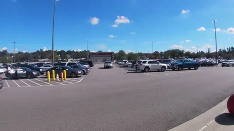 Pan of a full parking lot at a Target shopping center Stock Footage 142116611