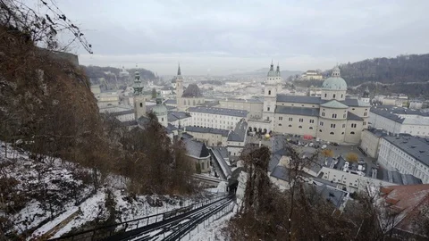 Pan from Funicular Tracks and roofs of Salzburg on sunny morning Stock Footage 120982399