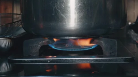 Pan on gas stove Stock Footage 303114811