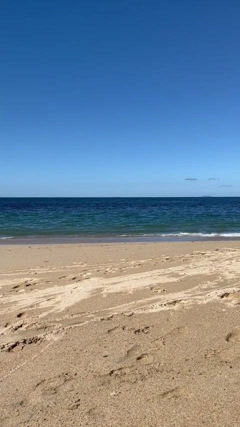 Pan of gentle waves on the beach Video stock 170461209