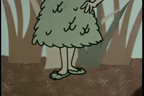 Pan up girl wearing matching dress, hat, and shoes made of leaves Stock Footage