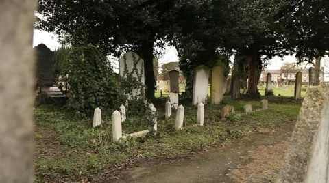 Pan onto grave yard Stock Footage 47319194
