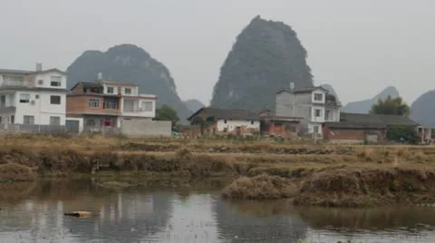 Pan Guilin China floating down river on bamboo raft  beautiful mountain Stock Footage 22424517