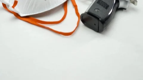 Pan Up Gun And FFP3 Face Mask Stock Footage 126015953