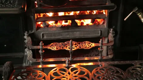Pan heats on kitchen range in edwardian era living museum Stock Footage 30632797