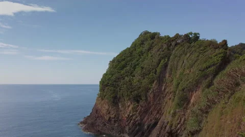 Pan up high angle view of a dangerous cliff with layers of rock formation Stock Footage 135141554