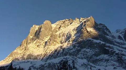 Pan + hold  Schreckhorn, a mountain in the Bernese Alps in Switzerland Stock Footage 34387397