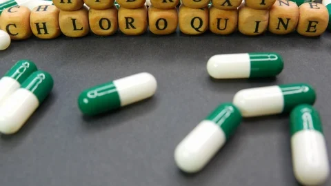 Pan up Hydroxychloroquine tablets for Covid-19 cure. Stock Footage 127519087