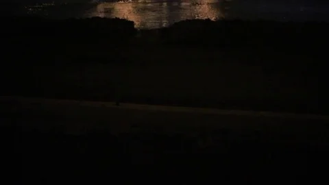 Pan up of I-10 bridge in New Orleans at night Stock Footage 72716979