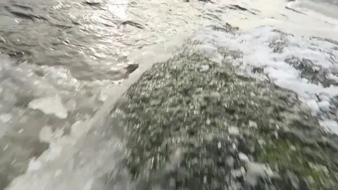 Pan from Ice Slabs to river ontop of Mountain Stock Footage 83938824