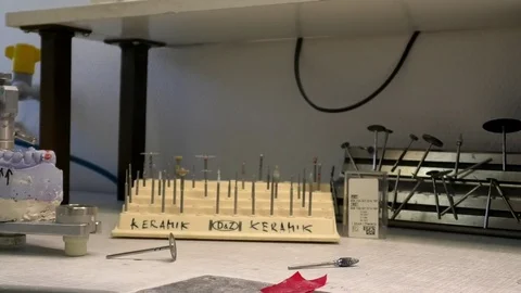 Pan: Instruments for prosthetic dentistry on a table of a dental laboratory Stock Footage 76778816