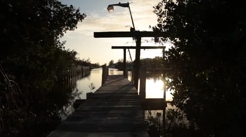 Pan onto jetty at sunset Stock Footage 48057927