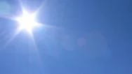 Pan Of Just The Sun And Blue Sky. Stock Footage