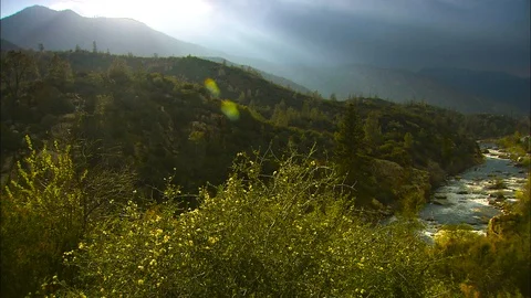 Pan to Kern River from magistic clouds over mountain Stock Footage 87307639