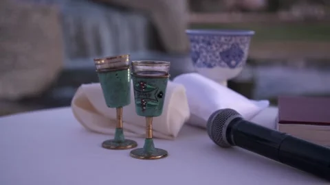 Pan of Kiddush Cups and Microphone Stock Footage 153781593