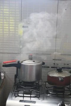 Pan on kitchen stove Stock Photos