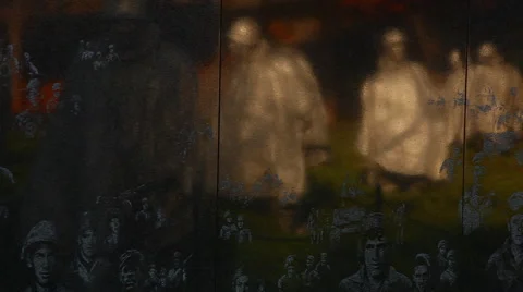 Pan of Korean War Veterans Memorial wall in Washington DC Stock Footage