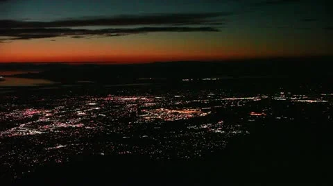 Pan L at Night / Twilight across Great Salt Lake and Lights of Utah Cities Stock Footage 12290337