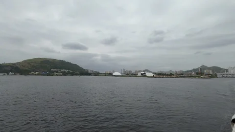 Pan. Landscape on a cloudy day, when the boat departs from Niteroi city. Stock Footage 125155601