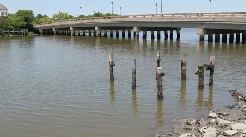 Pan of Large Bridge Past Rotting Dock 動画素材 57235412