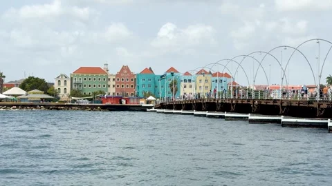 Pan Left Across Floating Pontoon Bridge and Colorful City Buildings Vídeos de archivo 336583977
