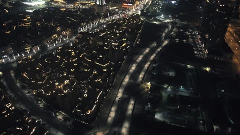Pan left and up at 150m from over Downtown Dubai, to reveal Burj Khalifa and Stock Footage 98983203