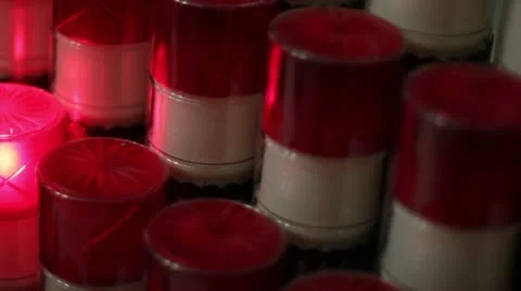 Pan left and right Catholic candles lit in church Vídeos de archivo 11136427