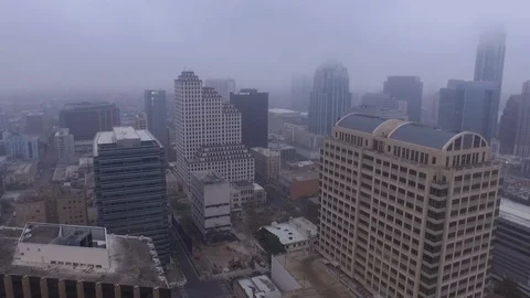 Pan Left of Austin Building Implosion with Downtown in Background on Overcast Stock Footage 87668188