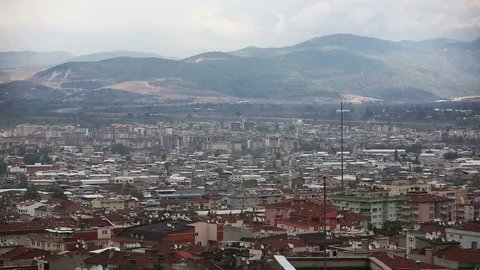 Pan left on Bursa cityscape with surrounding mountains, Turkey Stock Footage 119907919