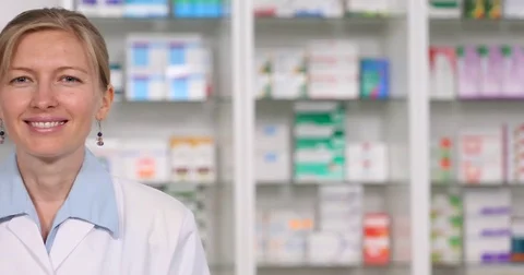 Pan Left Closeup Smiling Consultant Woman Looking Camera Salute Open Apothecary Stock Footage 72785221