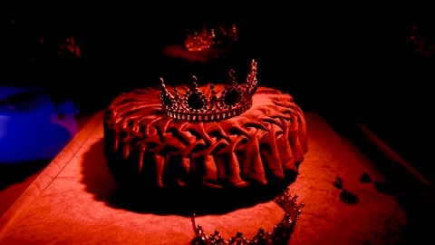 Pan left of crown on red pillow in display case museum Manhattan New York Stock Footage 254109620