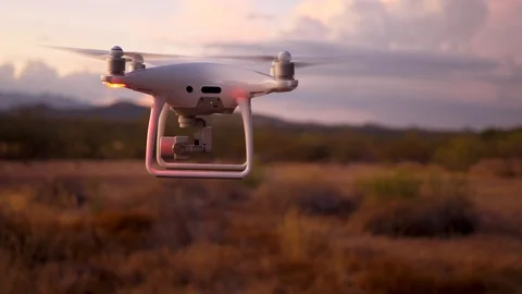 Pan Left Of Drone Towards Mountains At Dusk Video stock 115042624