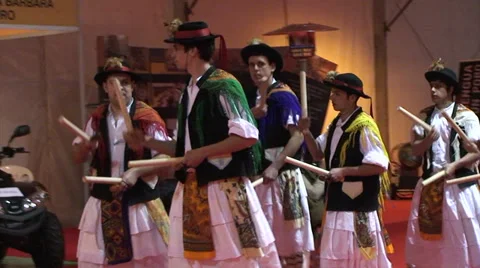 Pan left following celtic stick dancers walking in circle - Pauliteiros Stock Footage 37489694