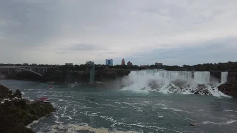 Pan left onto the full American Falls curtain and its boulder talus Stock Footage 345996050