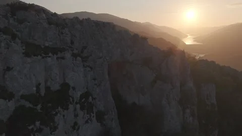 Pan Left From Giant Stone Arch To Golden Sunset 4K 60fps Vídeos de archivo 337431459