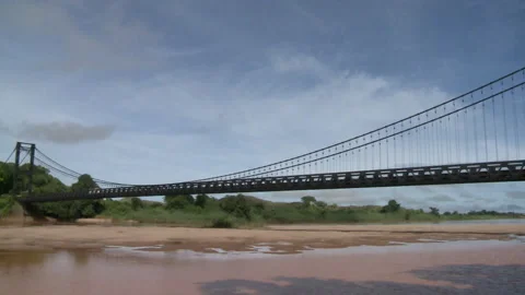 Pan left of a large bridge over a river Stock Footage 310541500