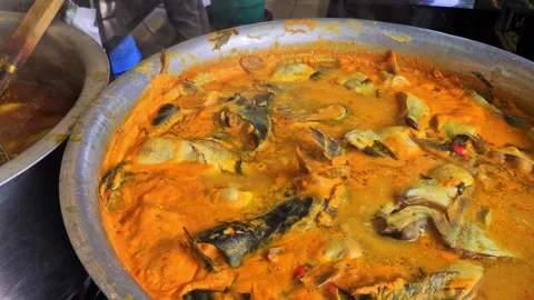 Pan left of Malay local dishes 'ikan patin' fish Stock Footage 330108459